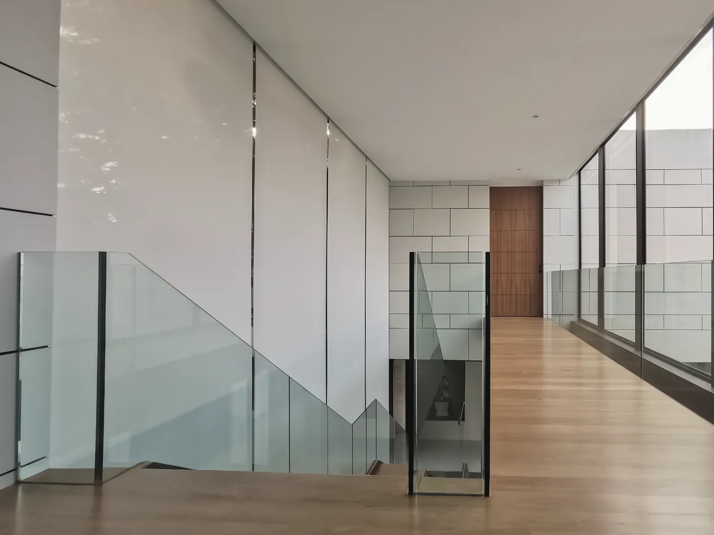 Stair hall, roller blinds on a double-height wall