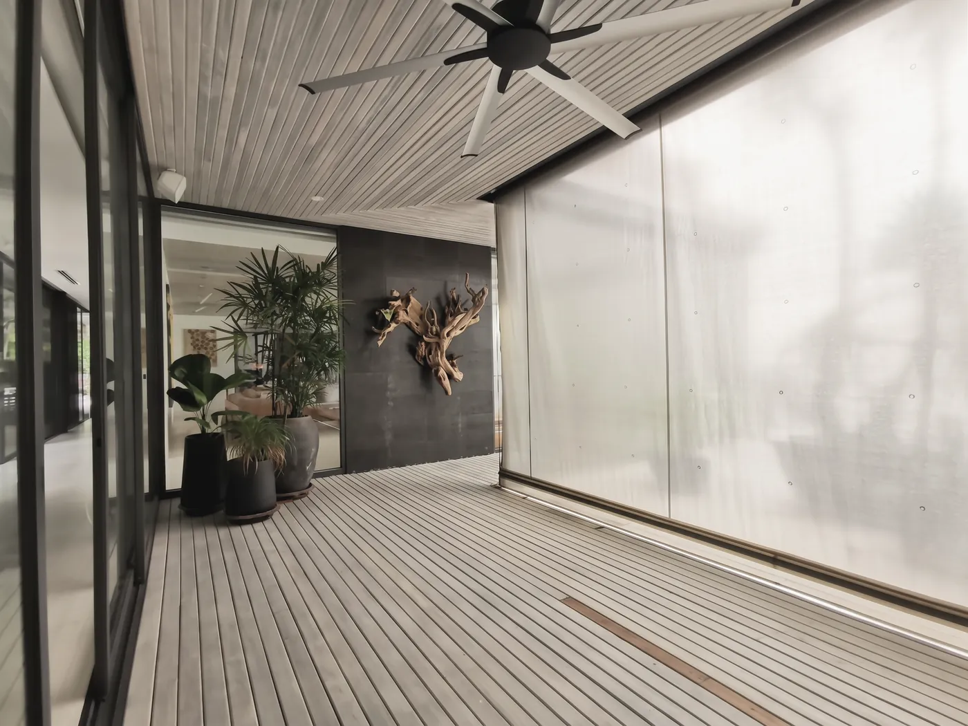 Timber terrace, outdoor rollers cutting the glare
